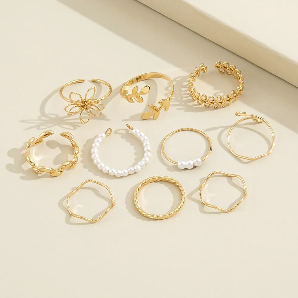 Women's openwork flower ring in gold colour J0656 with glossy electroplated finish and floral detailing