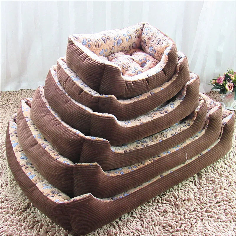 Beige plush sofa-style pet bed for a small dog, showing bolstered sides and padded construction.