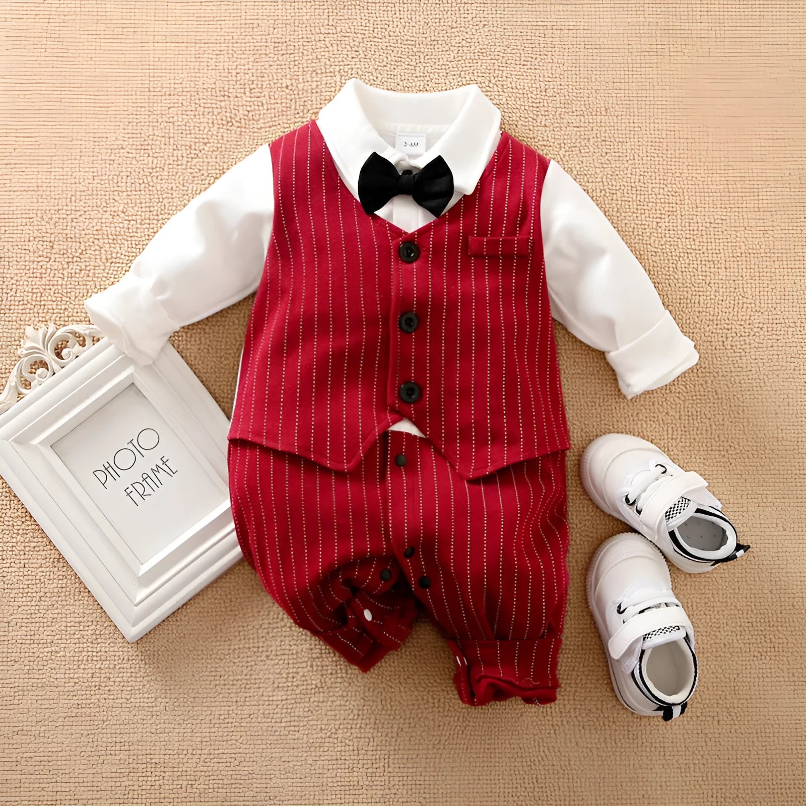 Wine red cotton baby boy romper with long sleeves and single-breasted closure for autumn.