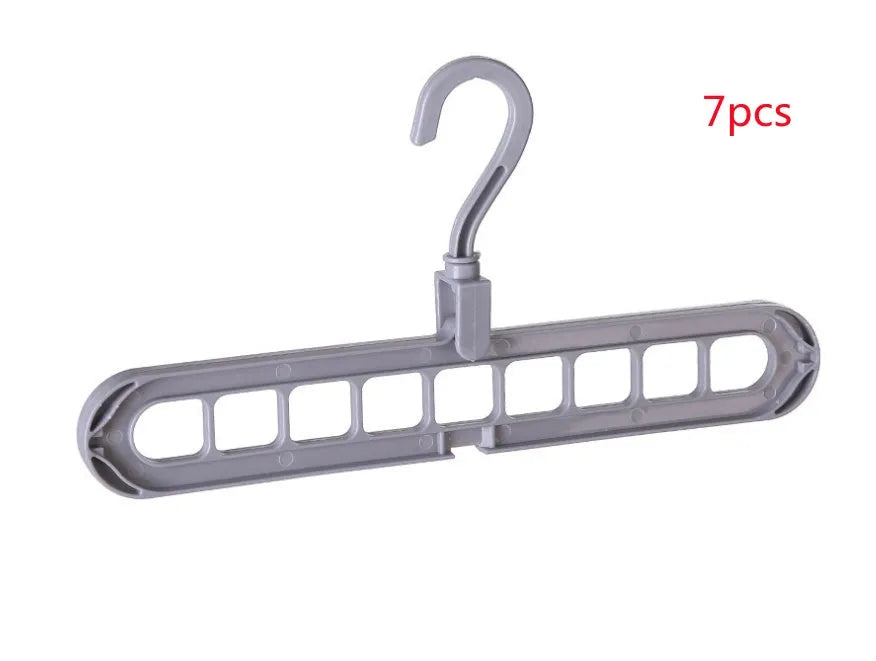Plastic clothes hanger with rotating hook in assorted colours on white background
