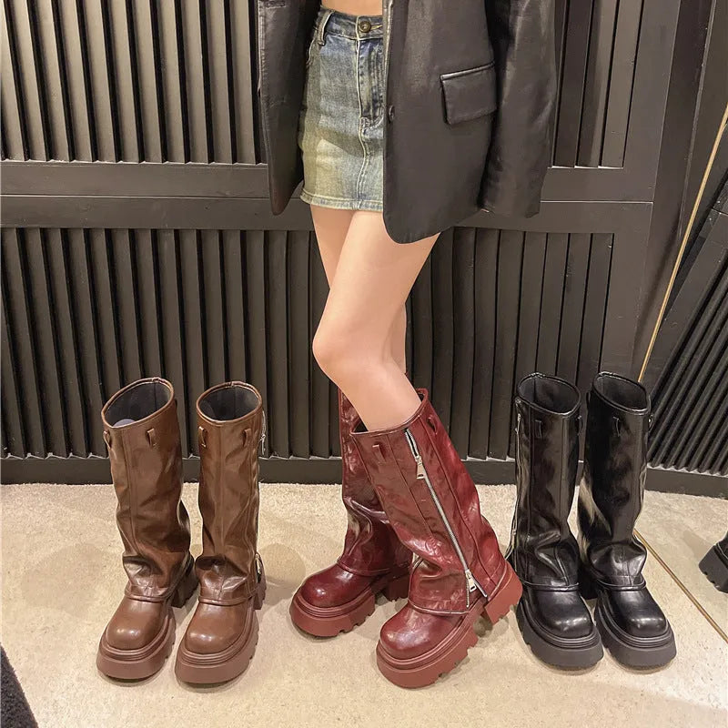 Women's black platform Martin boots with square heels and high cylinder socks on wooden floor