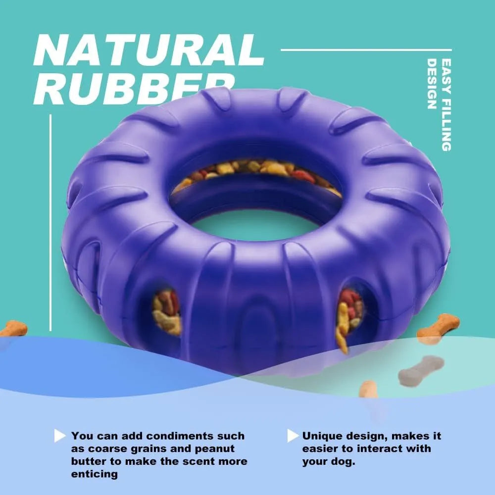 Blue rubber tire-shaped dog chew toy with oval openings, shown as a puzzle feeder for medium to large dogs.