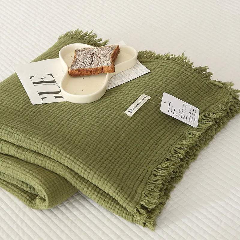 Four-layer gauze cotton blanket with tassel detailing in navy blue colour option
