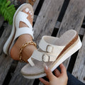 White women's wedge sandals with woven patent leather upper, peep toe, and finger-fit design on a rubber sole.