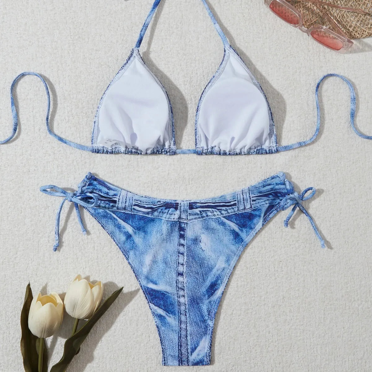 Women's blue denim print strappy bikini set, two-piece swimsuit on a white background.