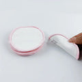 Set of red and blue velvet makeup remover pads in cotton mesh storage bag