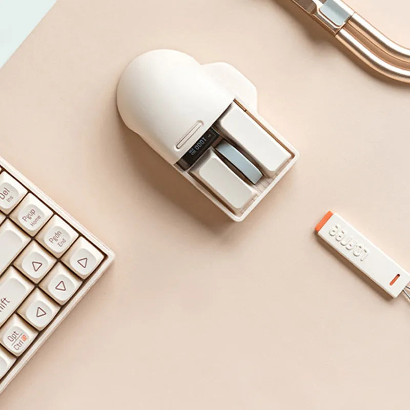 Tofu coloured wireless computer mouse with three connection modes and seven-button configuration.