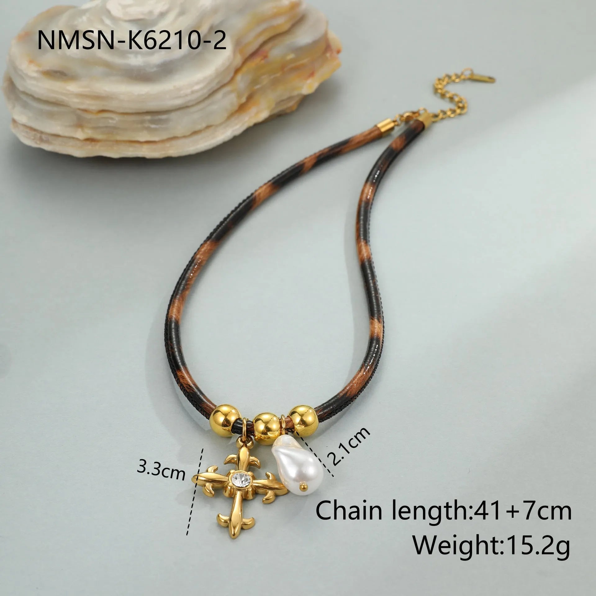 Geometric leopard print pendant on a gold-toned stainless steel necklace for women.