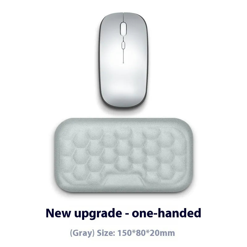 Customisable memory foam mouse wrist pad with black cloth cover on a desk.