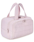 Large fluffy travel toiletry bag in beige colour with wide open design showing interior