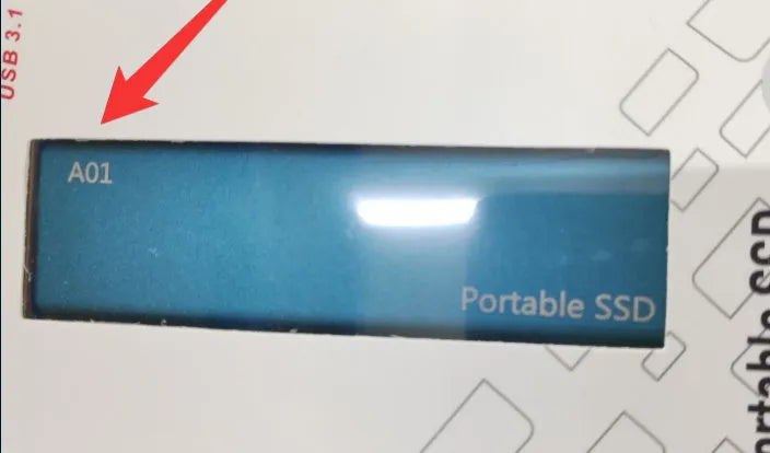 Metal-shell portable solid state drive with ultra-thin design on a desk.