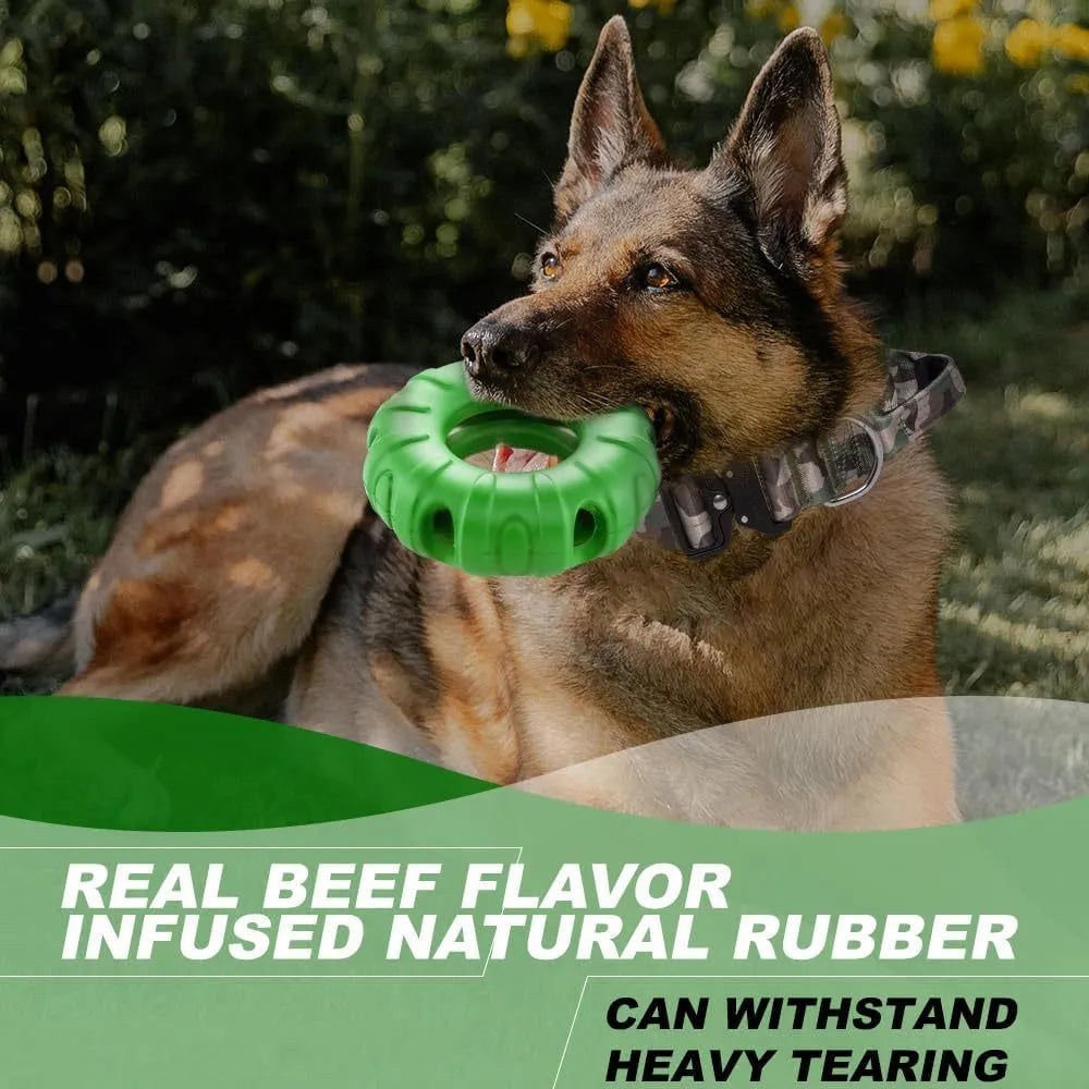 Blue rubber tire-shaped dog chew toy with oval openings, shown as a puzzle feeder for medium to large dogs.