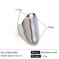 Gold plated geometric open titanium steel ring with striped design on white background
