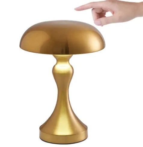 Bronze LED desk lamp with touch control showing three colour temperature settings on wooden desk