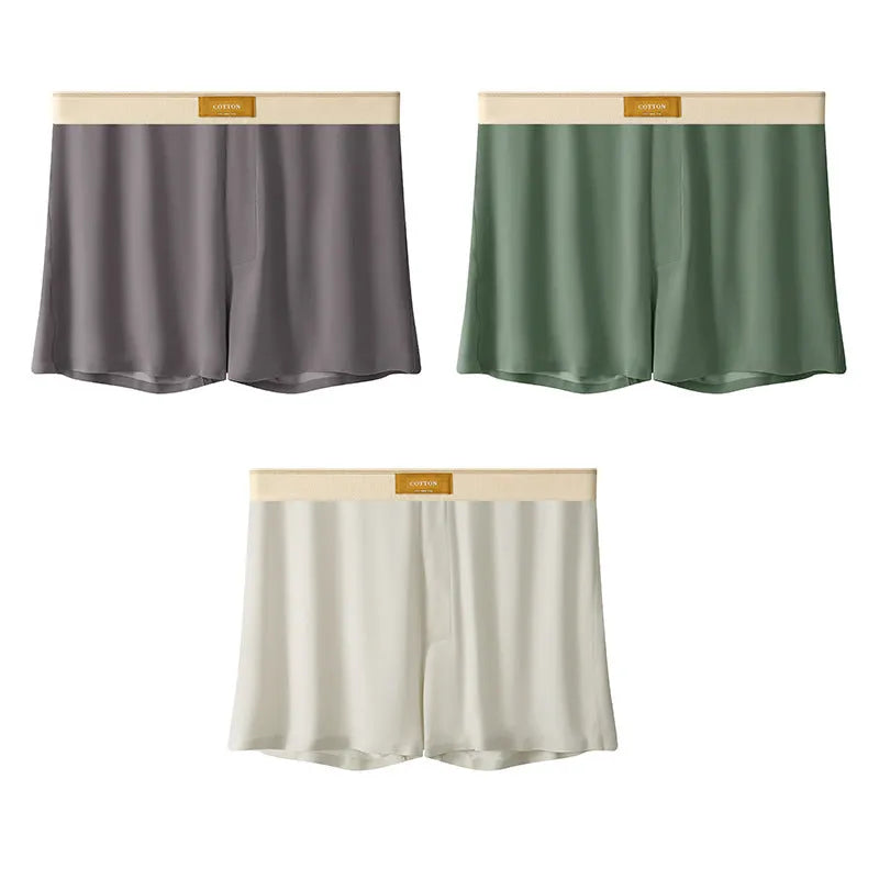 Pack of three pairs of men's solid colour ice silk underwear on a white background.