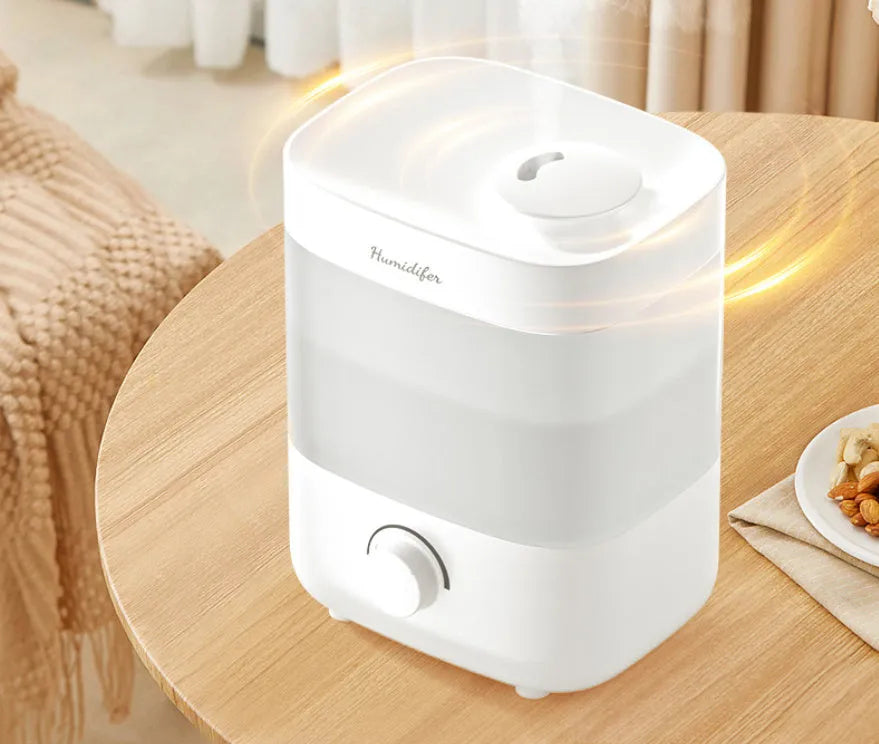 2L white plastic USB humidifier with dual spouts and night light on a desk