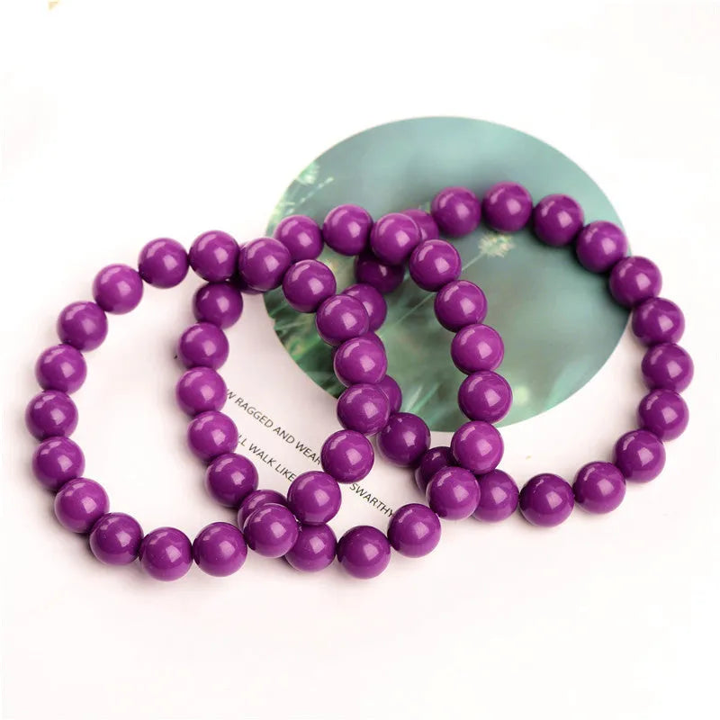 Jiuya polished crystal bracelet in 5A purple mica colour, showing single circle beads in one of three available sizes.