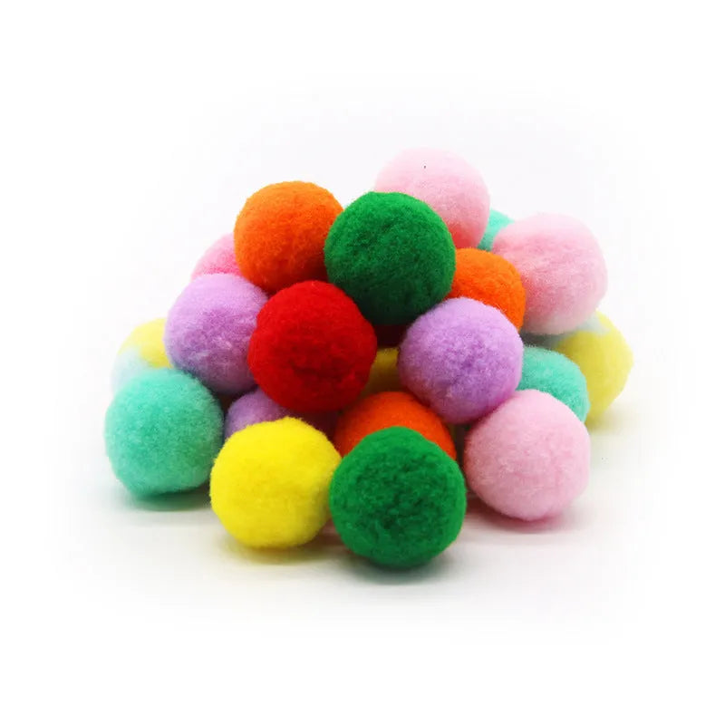 Plush ball launcher dog toy with soft pom-pom balls for indoor fetch games