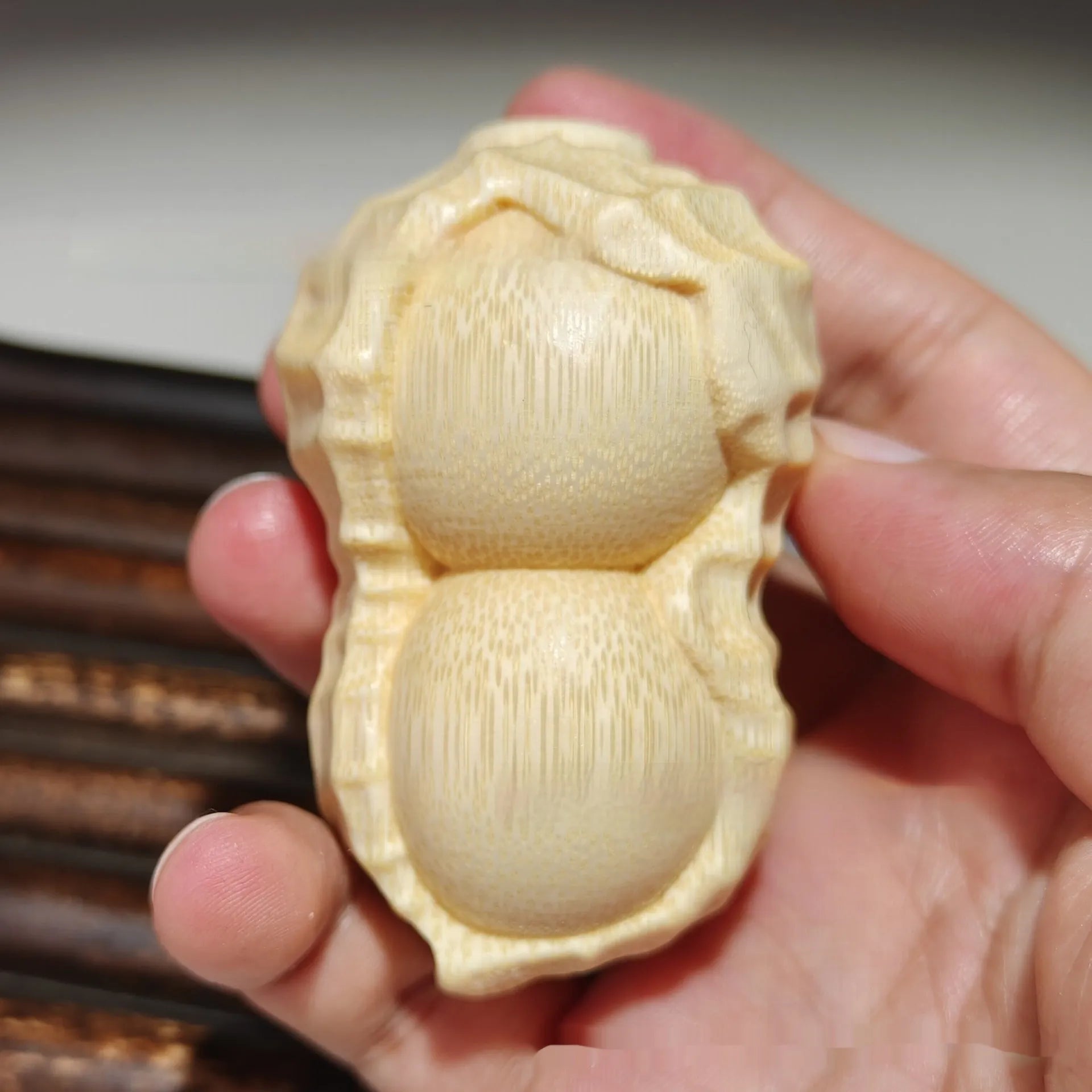 Natural bamboo carving peanut ornament with modern minimalist design and meaningful size detail
