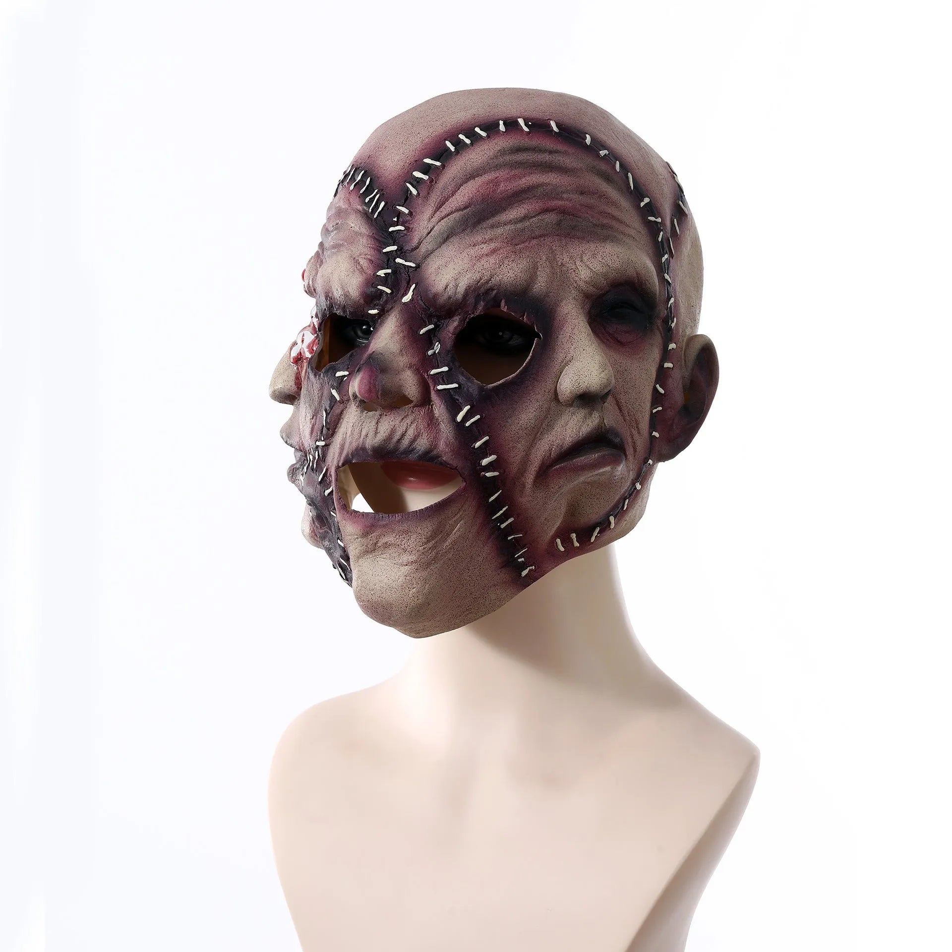 Three-sided grimace horror mask showing three distinct grotesque faces in natural latex