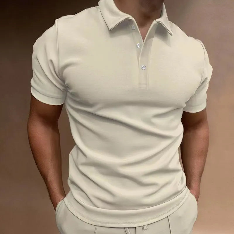 Man wearing a grey loose fit cotton blend short sleeve t-shirt for casual leisure wear.