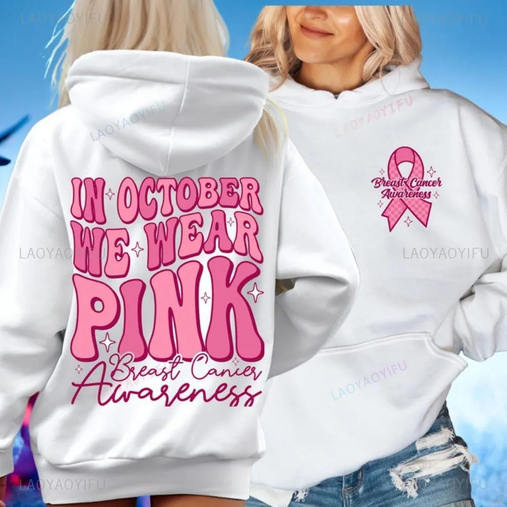 Women's pink breast cancer awareness pullover hoodie with retro graphic design and side seam pockets.