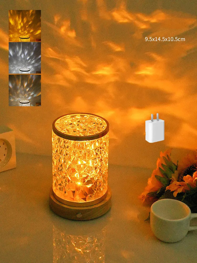 Modern rotating water ripple night light with acrylic body and solid wood base on a surface.