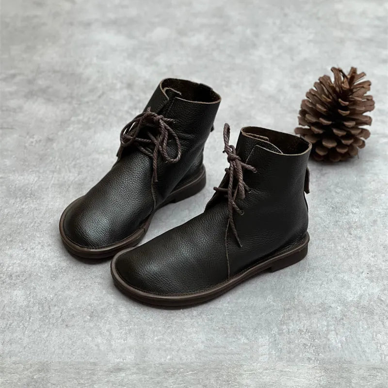 Retro genuine leather Martin boots for women in black, flat heel, round toe, front tie strap.