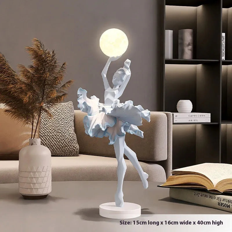 Small resin night light ornament in black gold colour with USB charging cable