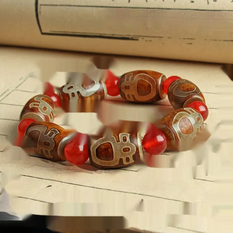 Agate Tibetan dzi bead bracelet with three-eye design and polished finish
