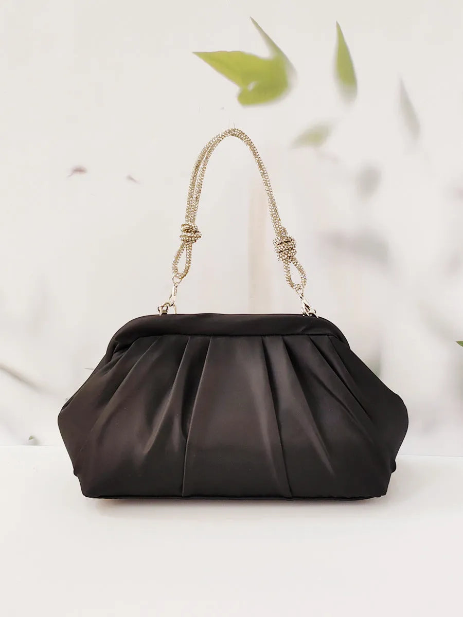 Soft shell-shaped women's large-capacity messenger bag in black, lavender purple, or rose red with fold and chain details.