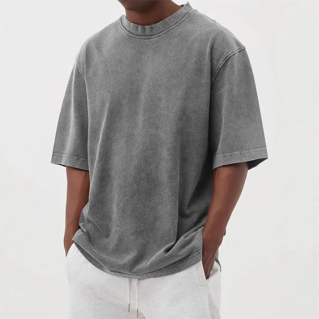 Men's loose fit distressed stone wash pullover t-shirt in solid colours like army green and blue.