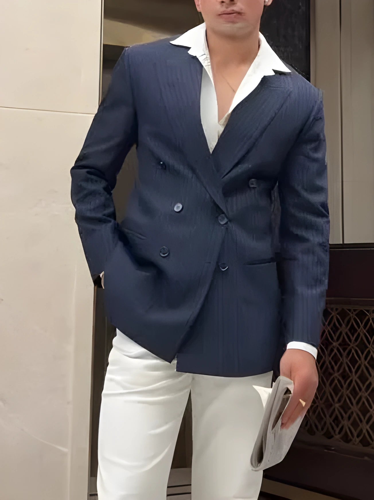 Men's striped double breasted blazer on hanger showing regular fit and classic design