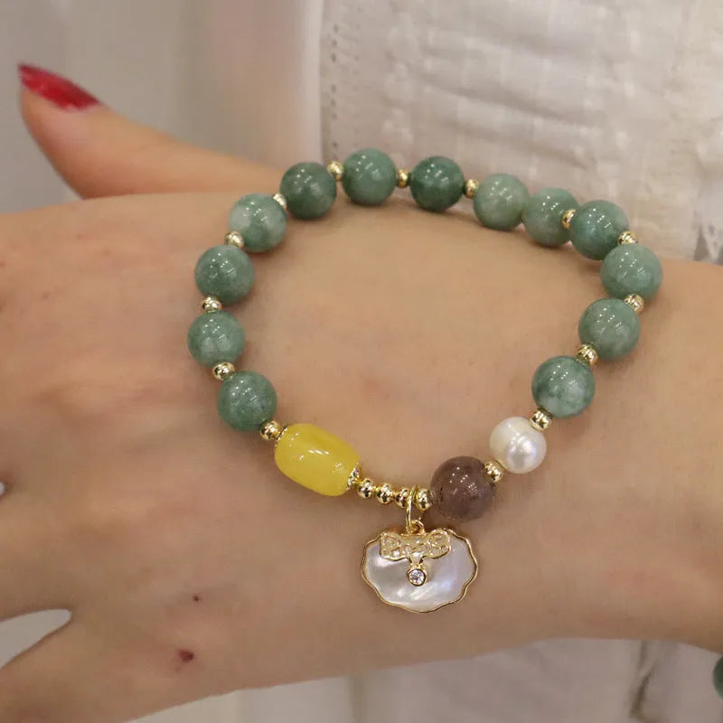 Women's casual bracelet with a single green jade bead on an adjustable band.