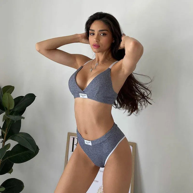 Women's embroidered bikini set with contrast binding letters in black colour showing sleeveless top and shorts
