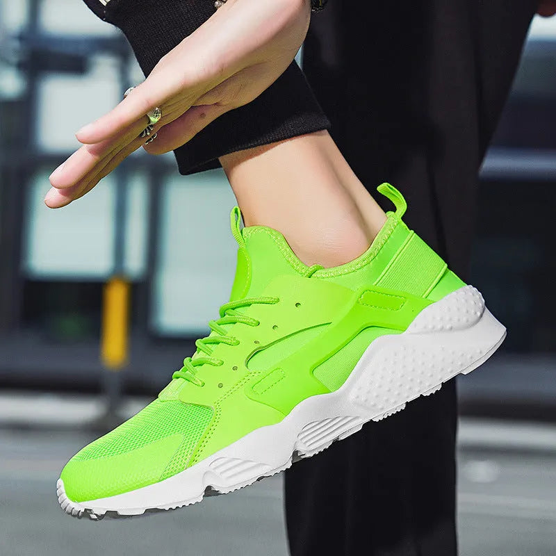 Men's fluorescent casual sneakers with mesh upper, cross shoulder straps and flat sole.