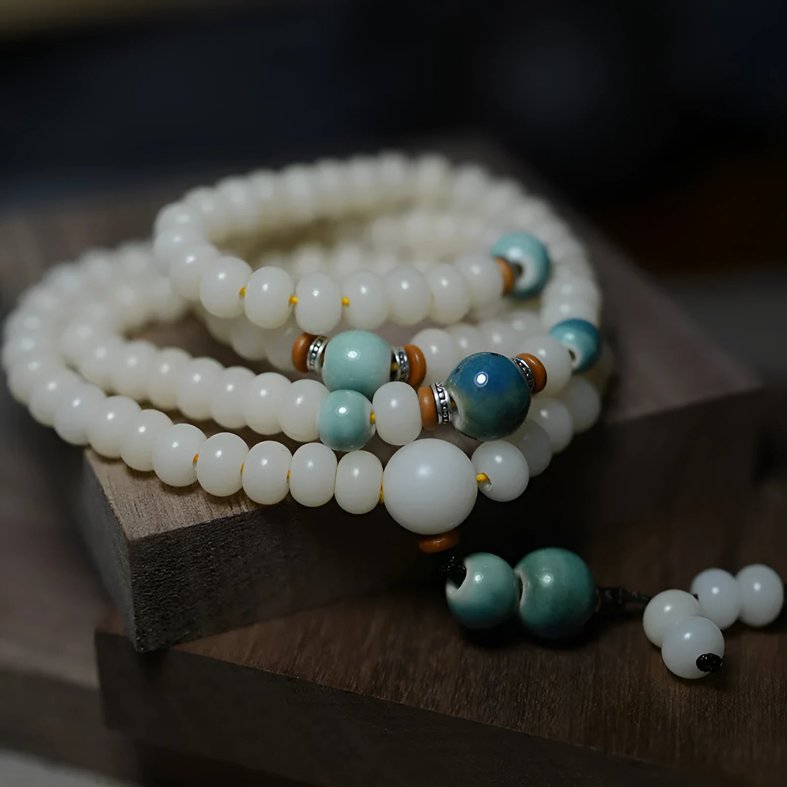 White jade bodhi seed bracelet with 108 flat round beads in 7x9mm and 8x10mm sizes.