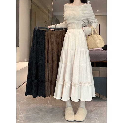 Korean style corduroy A-line midi skirt with elastic waistband in milky white colour on hanger