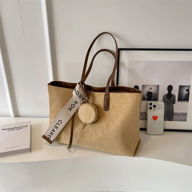 Large polyester shoulder tote bag in horizontal square shape with zipped compartment and sandwich pocket