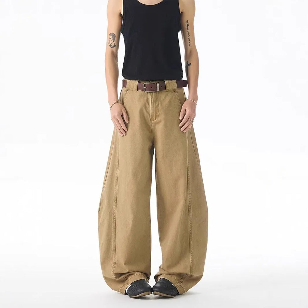 Men's brown loose-fit straight leg denim jeans on a plain background