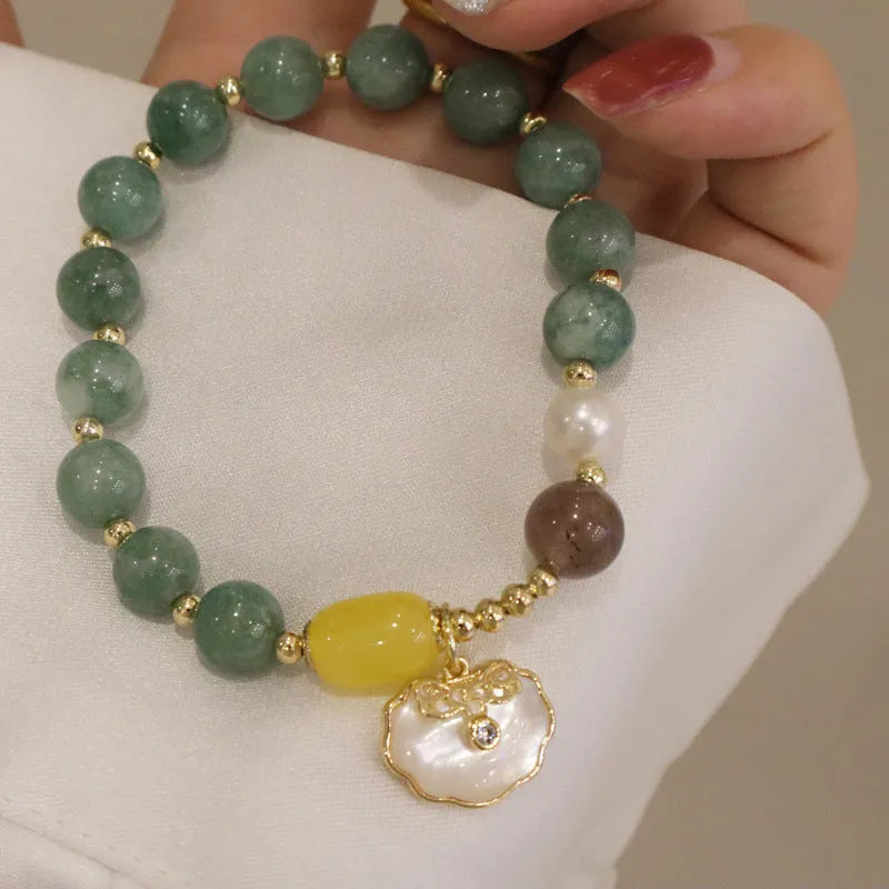Women's casual bracelet with a single green jade bead on an adjustable band.