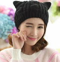 Handmade knitted cat ear beanie in red colour showing 3D ear design