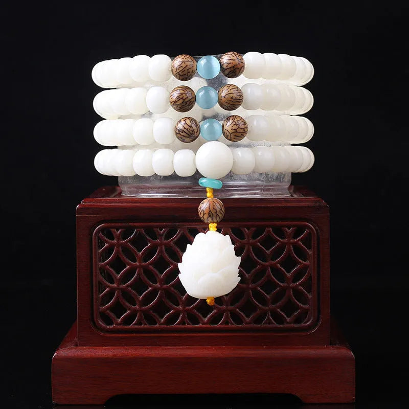 White jade Bodhi seed bracelet with 6x8mm beads showing multiple decorative style options