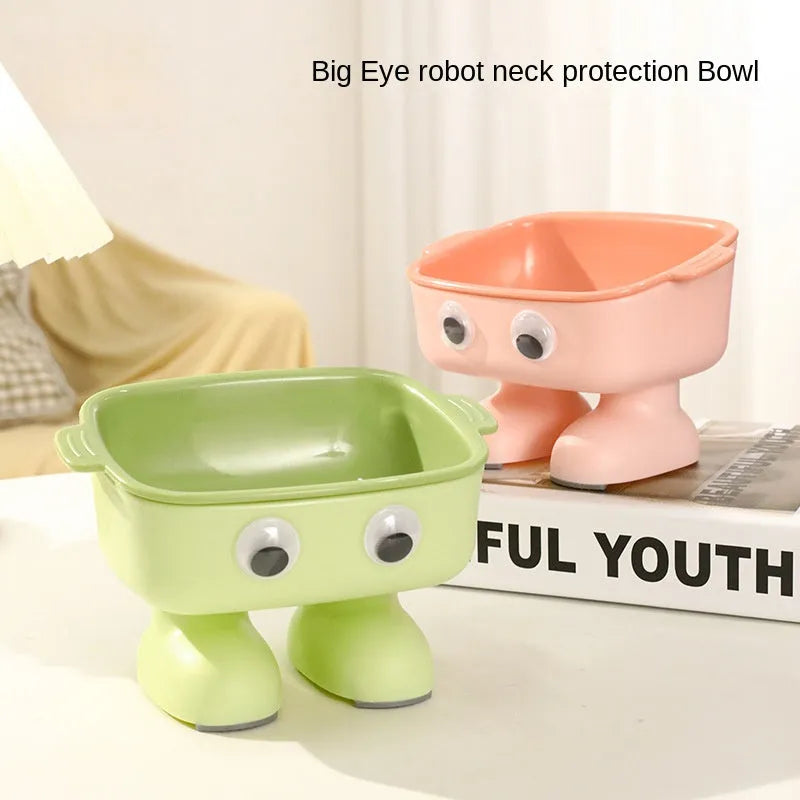 Green robot-shaped elevated cat bowl with tilted dish and anti-slip base.