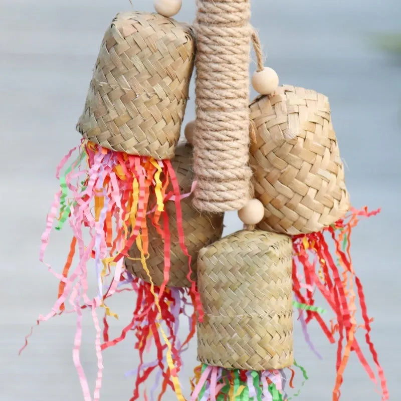 Wood and sisal parrot toy with colourful shredded paper centre for biting and foraging.