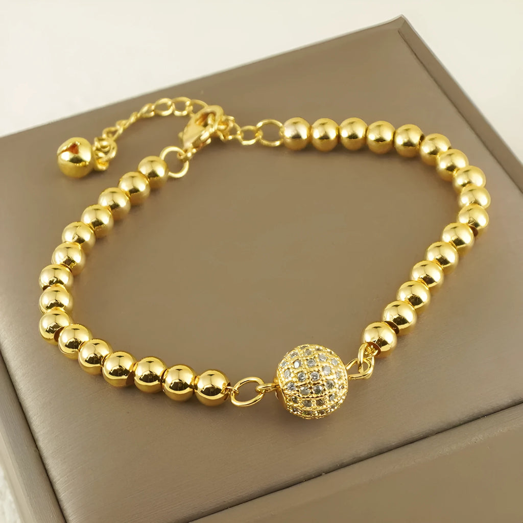 Copper bracelet with heart shape design, zircon accents and Arabic style patterning