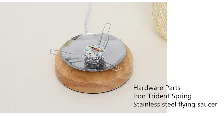 Brown hemp rope Sepak Takraw ball desk lamp on a wooden base with USB cable.