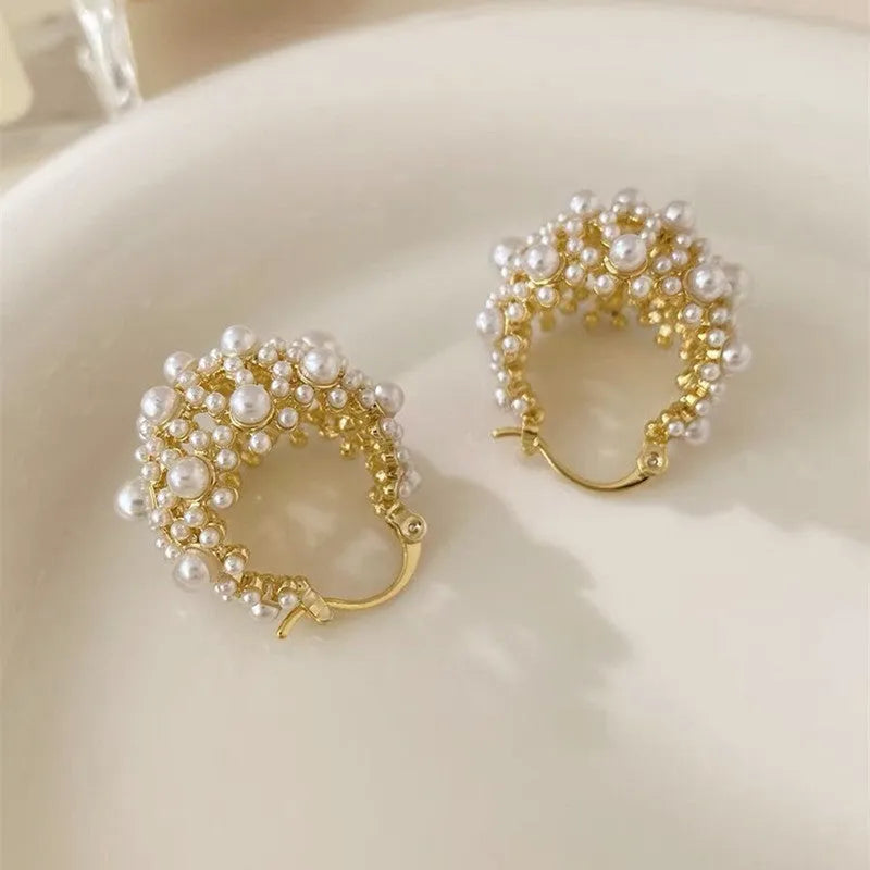 Women's gold-coloured copper flower basket earrings with small bead detailing and pearl inlay treatment