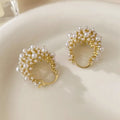 Women's gold-coloured copper flower basket earrings with small bead detailing and pearl inlay treatment