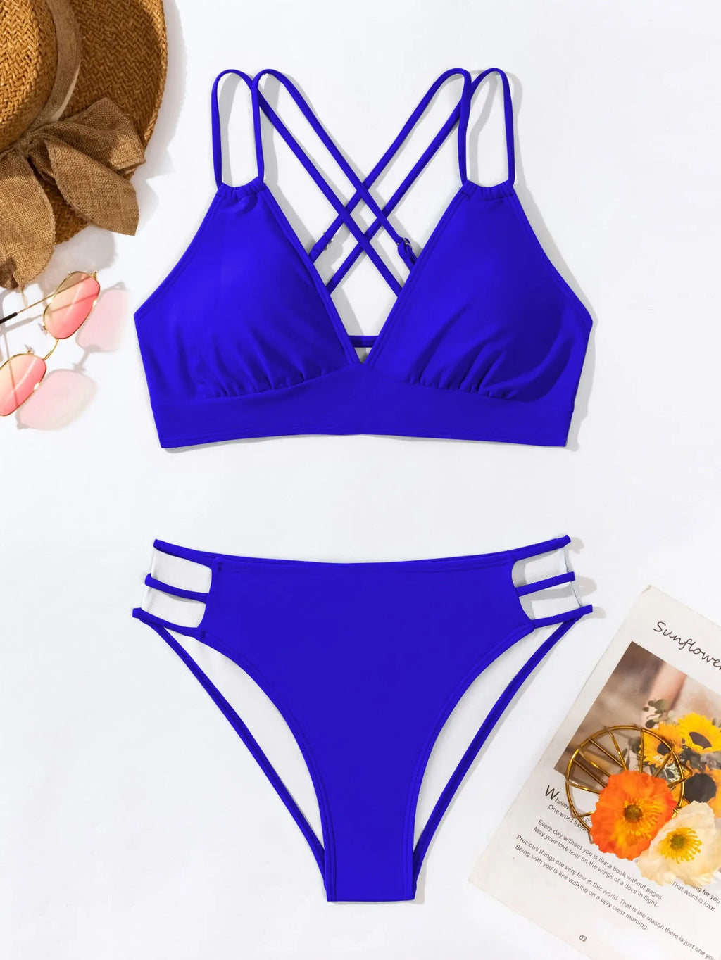 Women's black V-neck halter bikini with removable padded bra and split shorts.